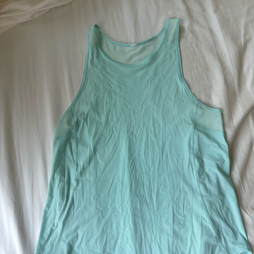 Never worn Lululemon tank top with mesh in size 6.